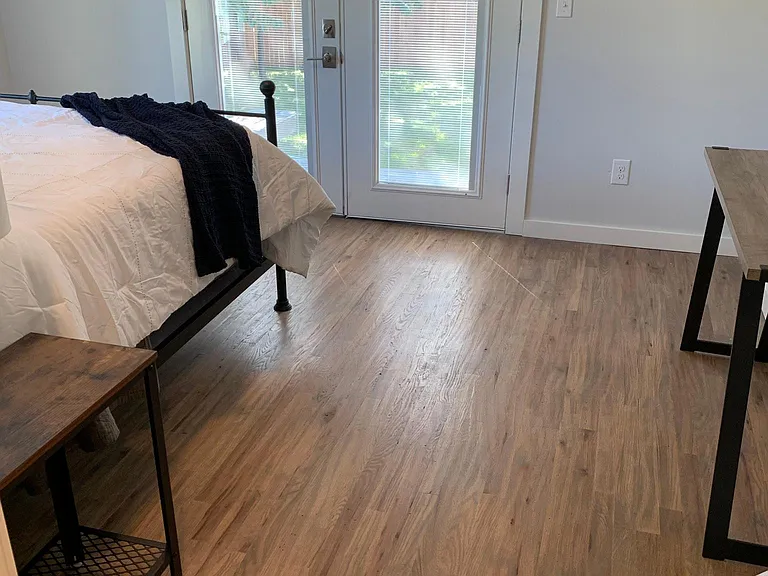 MASTER BEDROOM WITH FRENCH DOORS TO BACKYARD DECK