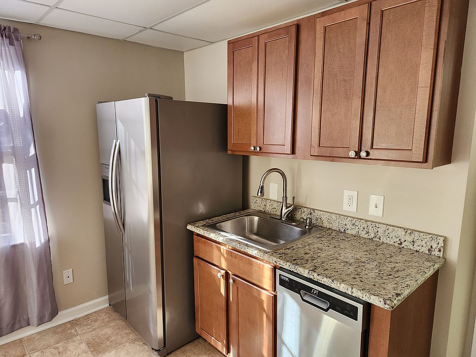 Kitchen, fridge with ice/water dispenser on outside, cabinets, granite countertop