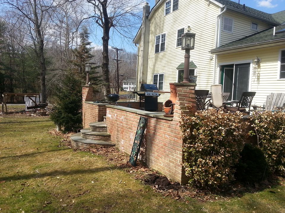 Raised brick and stone patio
