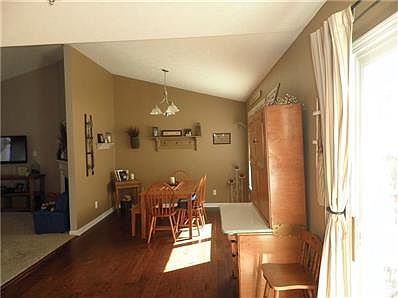 Breakfast Room and Dining Room flow into the kitchen with beautiful handscraped hardwood floors