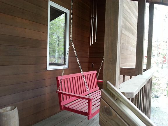 Front porch swing to enjoy the relaxation and quiet of Hemlock Farms