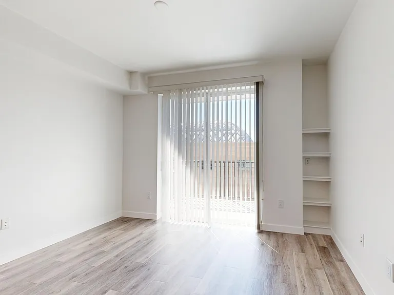 Apartment living room with wood-style flooring.