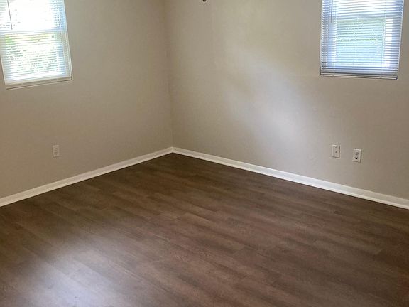 Both bedrooms have new flooring as well as the living room and hall. All have this flooring and wall color.