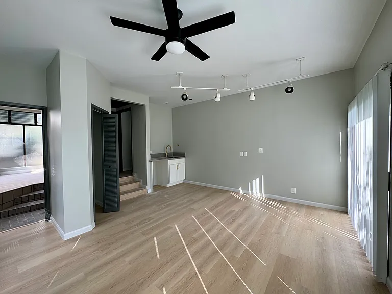 Downstairs bed with wet bar and connected full bath.