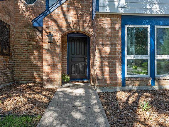Warm and welcoming front door leads to an inviting home.