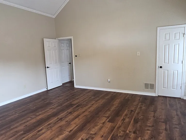 Master Bedroom with brand new wood flooring.