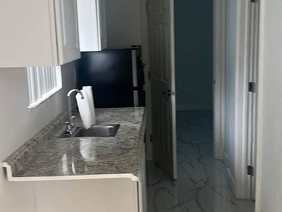 Kitchen leading to the bedroom