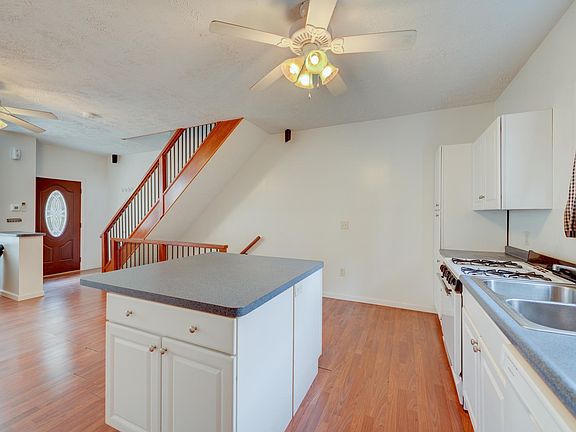 Living Room / Kitchen - microwave, stove, oven, and fridge included