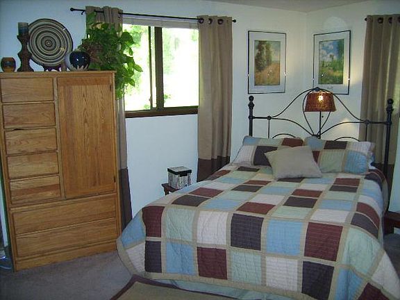 Master bedroom w/bath and view of gardens