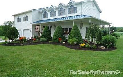 Exterior of home
						:
						Exterior view with new metal roof, professional landscaping & wrap around porch