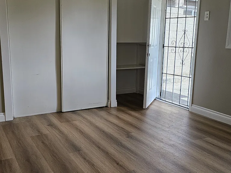 Bedroom with ceiling fan and mini split ac/heating system