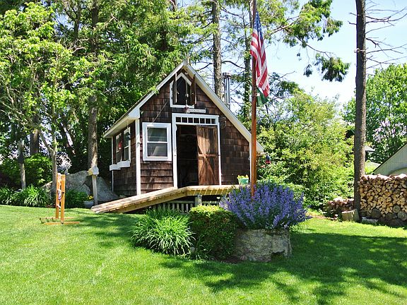 Heated shed with wood stove