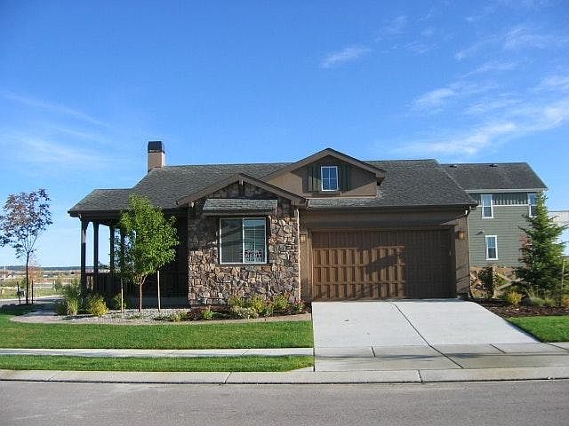 The front of the home, looking towards North. The windows look out from the 4th bedroom or office.
