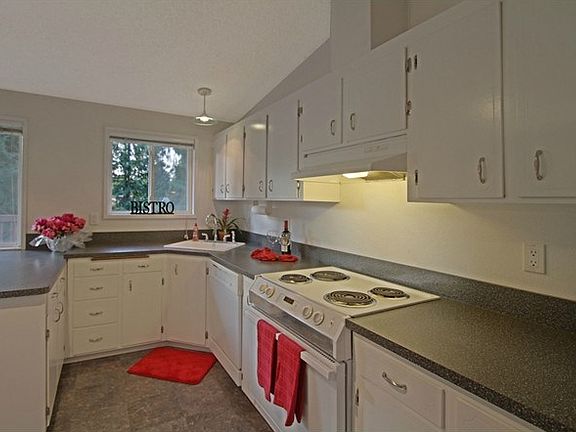 Plenty of cabinets and ample counter space~
