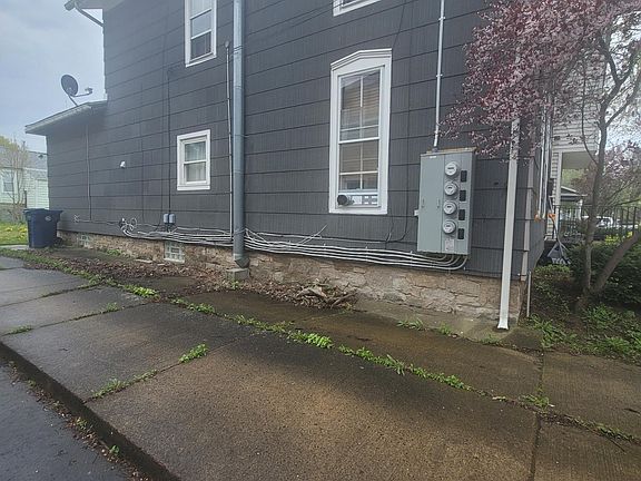 Side view of long driveway path to back yard
