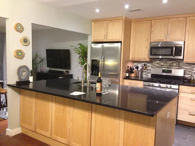 Kitchen open to living room and dining room