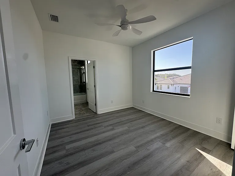 second floor bedroom with full bath