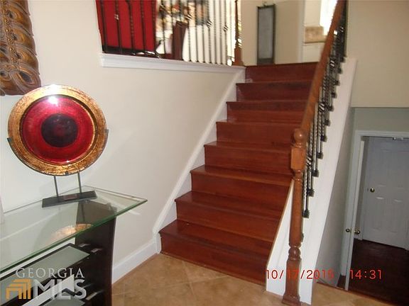 Staircase at front door and basement
