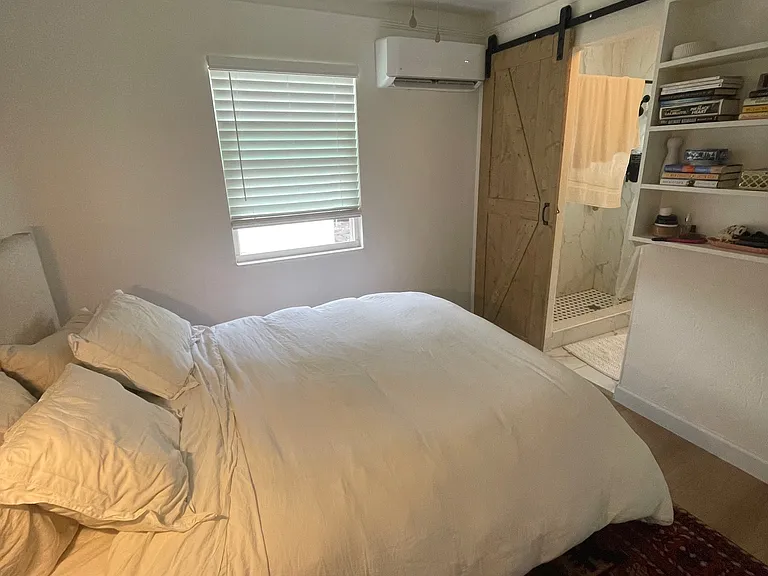 Bedroom 1 has built-in bookshelves