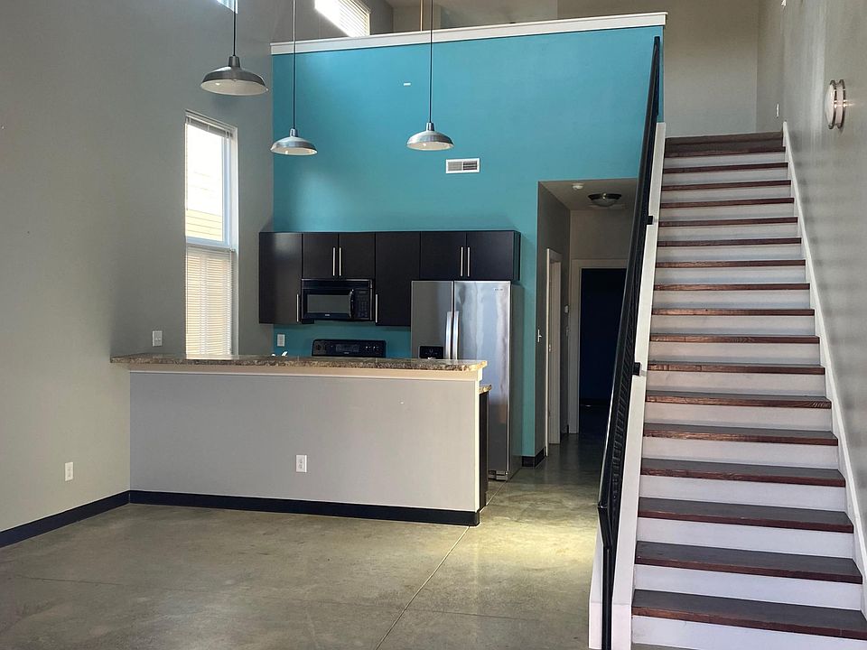 Entry. Living room and kitchen.
