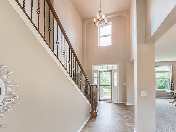 The stairway is stunning with the rod iron spindles and brand new carpeting.