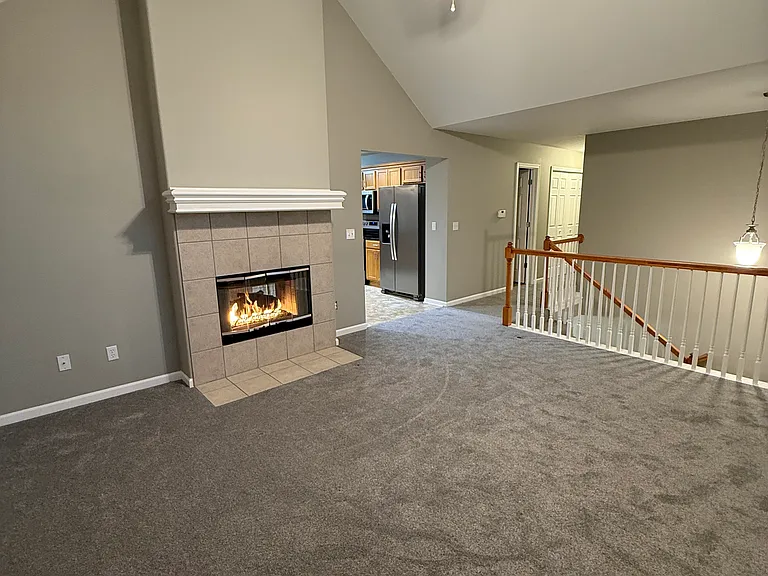 Great room with see-through gas fireplace to the country kitchen