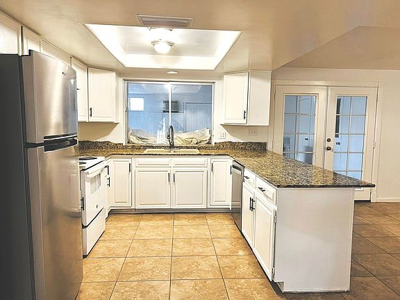 New full sized fridge, dishwasher, stove top oven included.