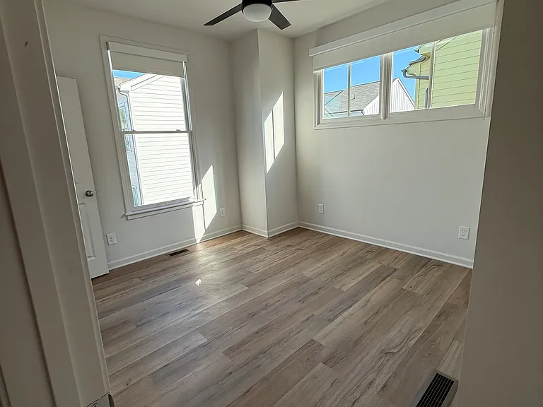 2nd bedroom with remote controlled ceiling fan and light