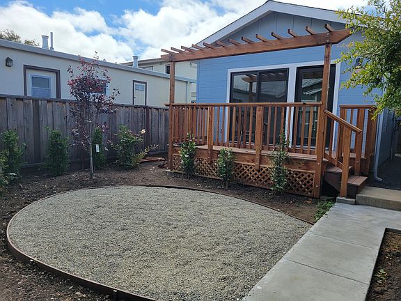 Shared yard with separate unit behind.