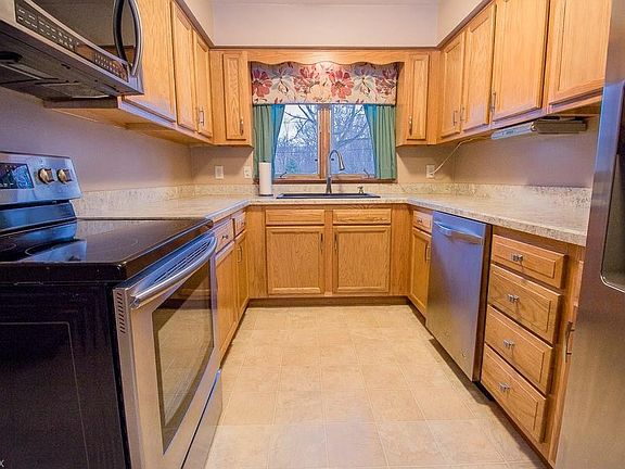 THE UPDATED KITCHEN INCLUDES STAINLESS APPLIANCES
