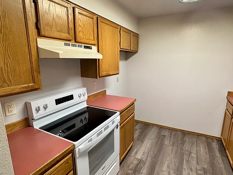 Kitchen with brand new oven/stove and dishwasher.