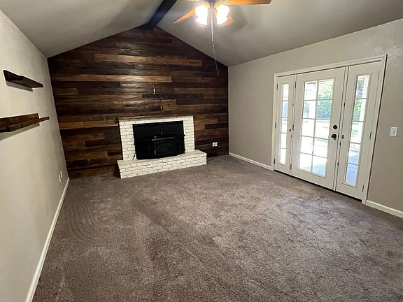 Family room with backyard access to screened in patio.