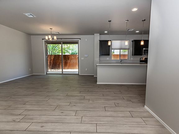 Entry Area Looking to Dining and Kitchen