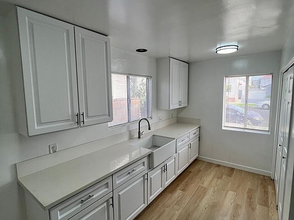 Kitchen with new cabinets ans farmhouse sink