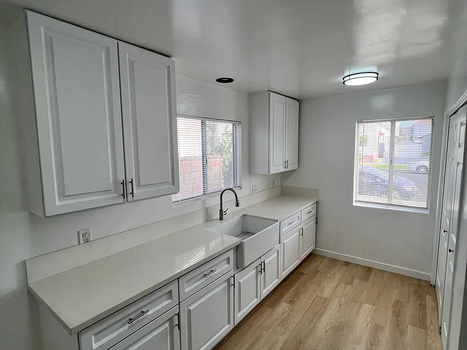 Kitchen with new cabinets ans farmhouse sink