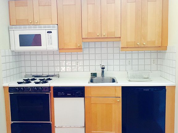 quaint kitchen with new appliances