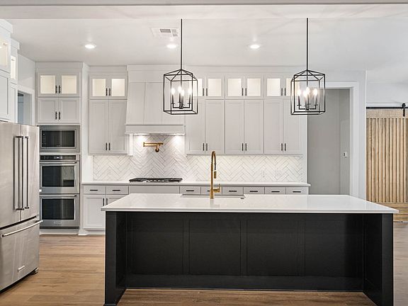 The Thunderbird II has a large kitchen island with quartz countertops.