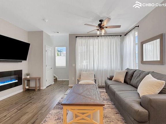 Living Room - ceiling fan and leather couch