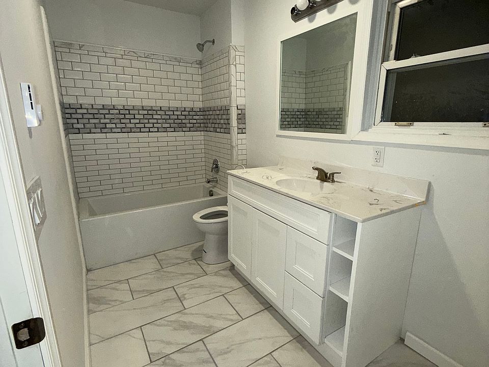 Large bathroom with ceramic tile & jetted tub
