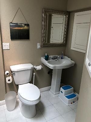 bathroom for two bedrooms, also has tub and shower combination