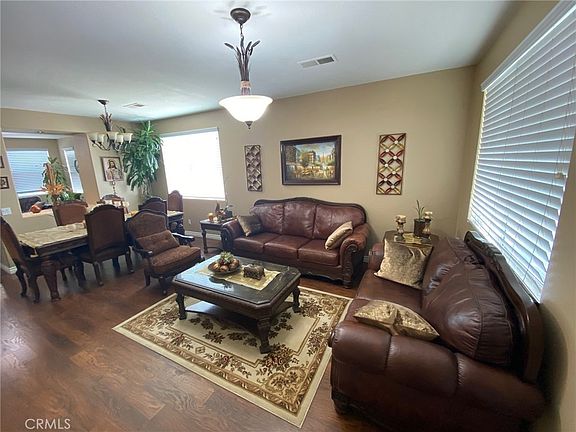 Formal living room upon entry! Plently of natural lighting and beautiful light fixtures!