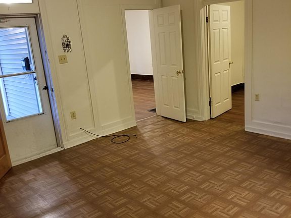 Living room and doors to two bedrooms