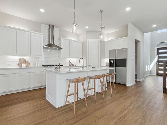 Kitchen in the Picasso II home plan by Trophy Signature Homes - REPRESENTATIVE PHOTO