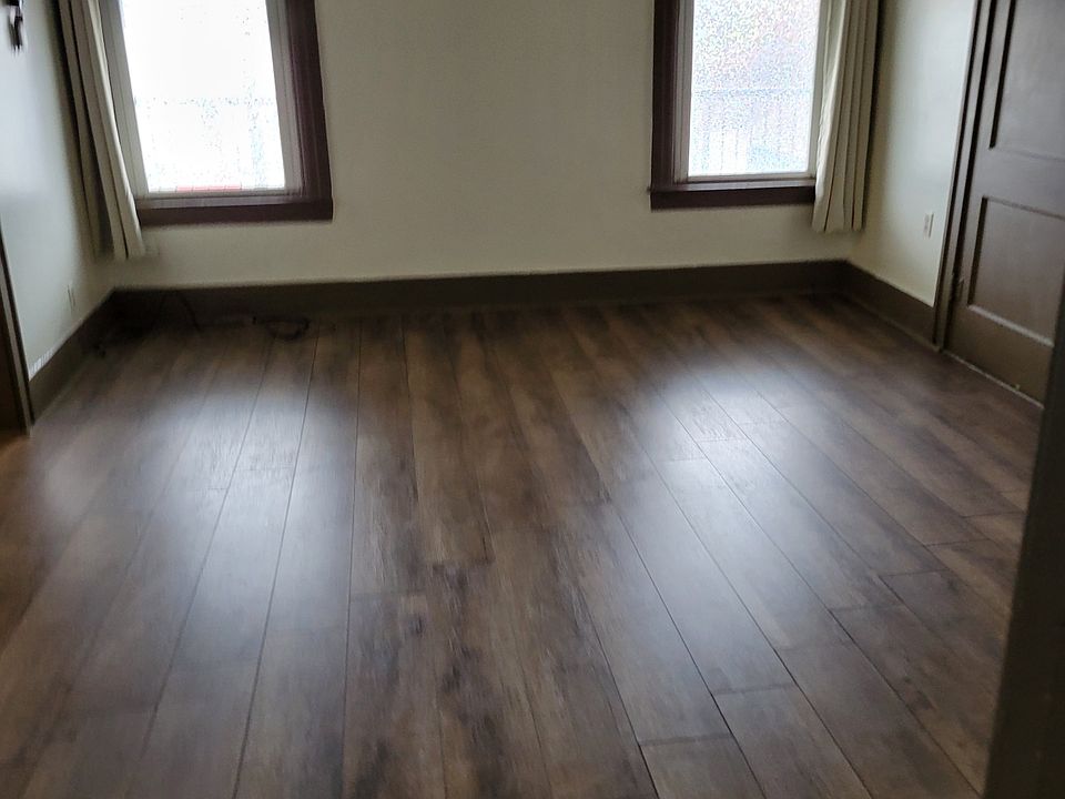 Large living room with large windows.