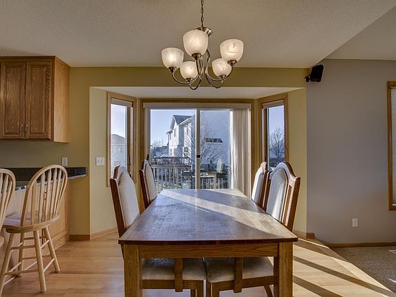 Patio door leads out to large maintenance free deck with lighting