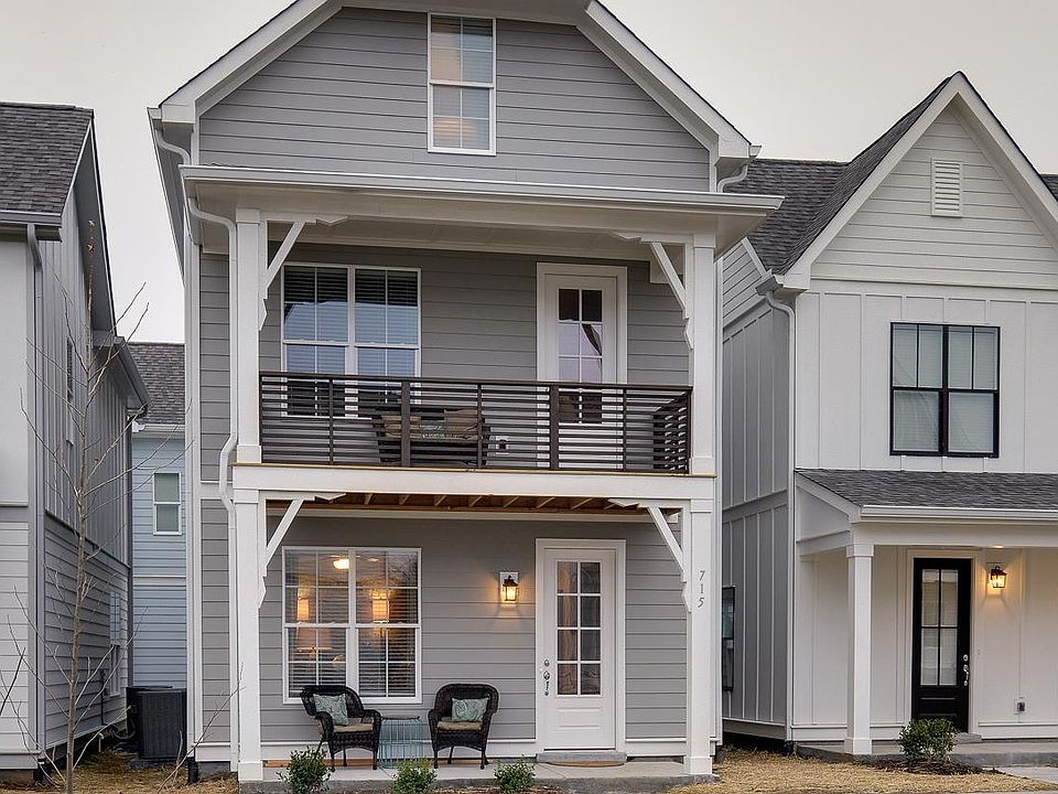 Covered front porch and second-floor deck that is also covered. Parking directly out the back door and also to the right of this unit. Lots of parking