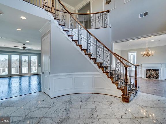 Dramatic 2 Story Foyer with Marble Floor