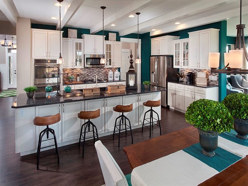 Gourmet Kitchen Pictured. Island with seating, dining area, walk-in pantry