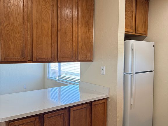 Kitchen includes stove/range, new stainless-steel sink and new refrigerator. Plenty of cabinet and counter space.