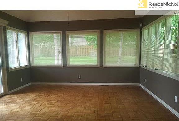 The huge sun room is open to the kitchen and dining room